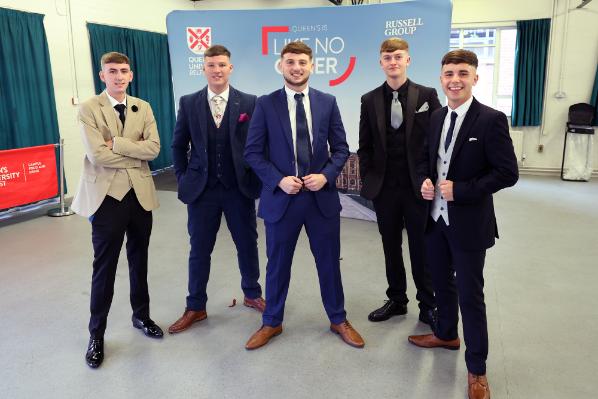 Graduates excitedly waiting to have their gowns fitted